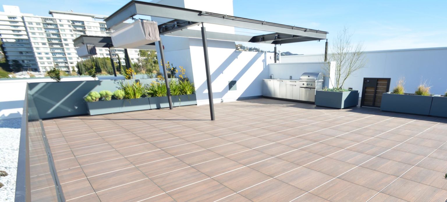 3 Creative Ways To Use Roof Turf on Your Rooftop Patio - Tile Tech Pavers